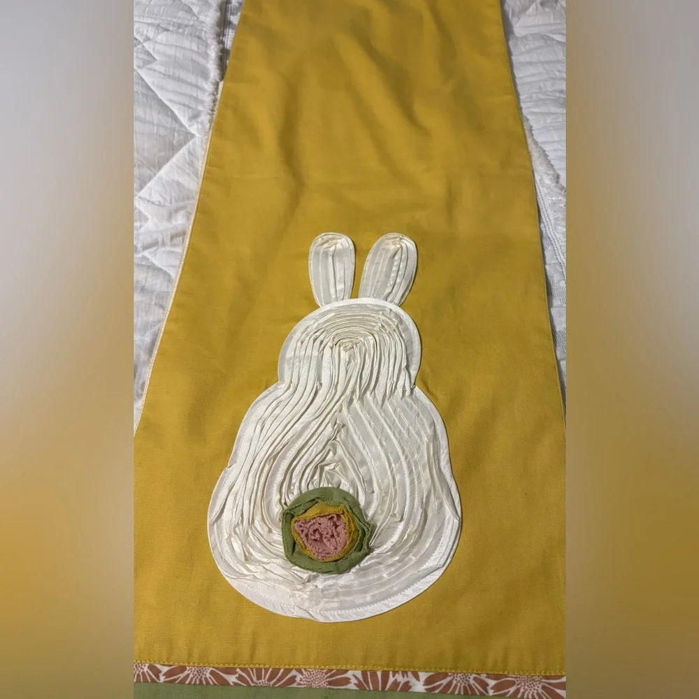 Cute bunny table runner by Pier 1 Imports. Golden yellow with cream bunnies.